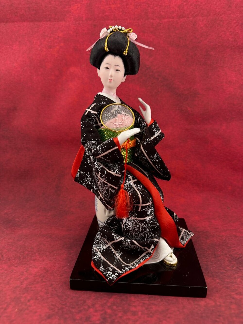 VINTAGE TRADITIONAL JAPANESE GEISHA DOLL SITTING ATOP A PORCELAIN GARDEN STOOL